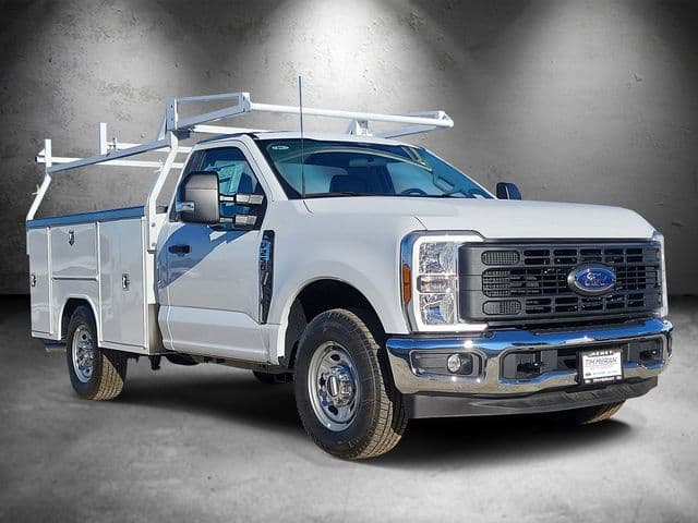 Ford F-250 Super Duty regular cab fitted with a white Harbor service body and ladder rack, front three-quarter view