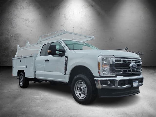 Ford F-350 Super Duty super cab fitted with a Scelzi service body and ladder rack, front three-quarter view